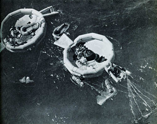 TSgt Vigare in a liferaft recovering Discoverer XXIX